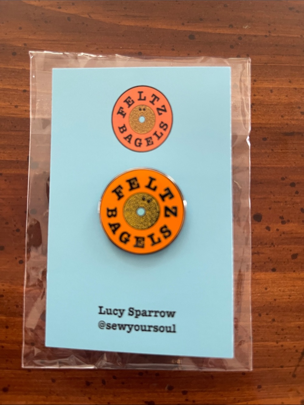 Lucy Sparrow Orange Feltz Bagels Enamel Pin